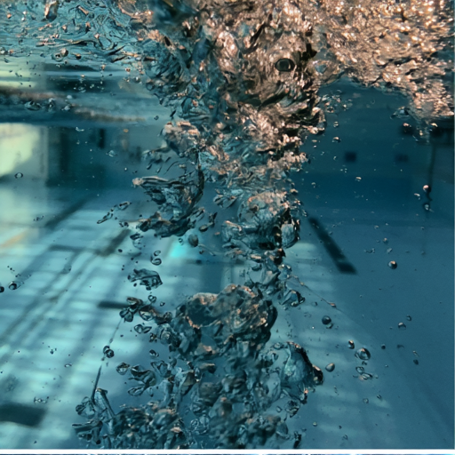Column of bubbles rising through the water after a stroke